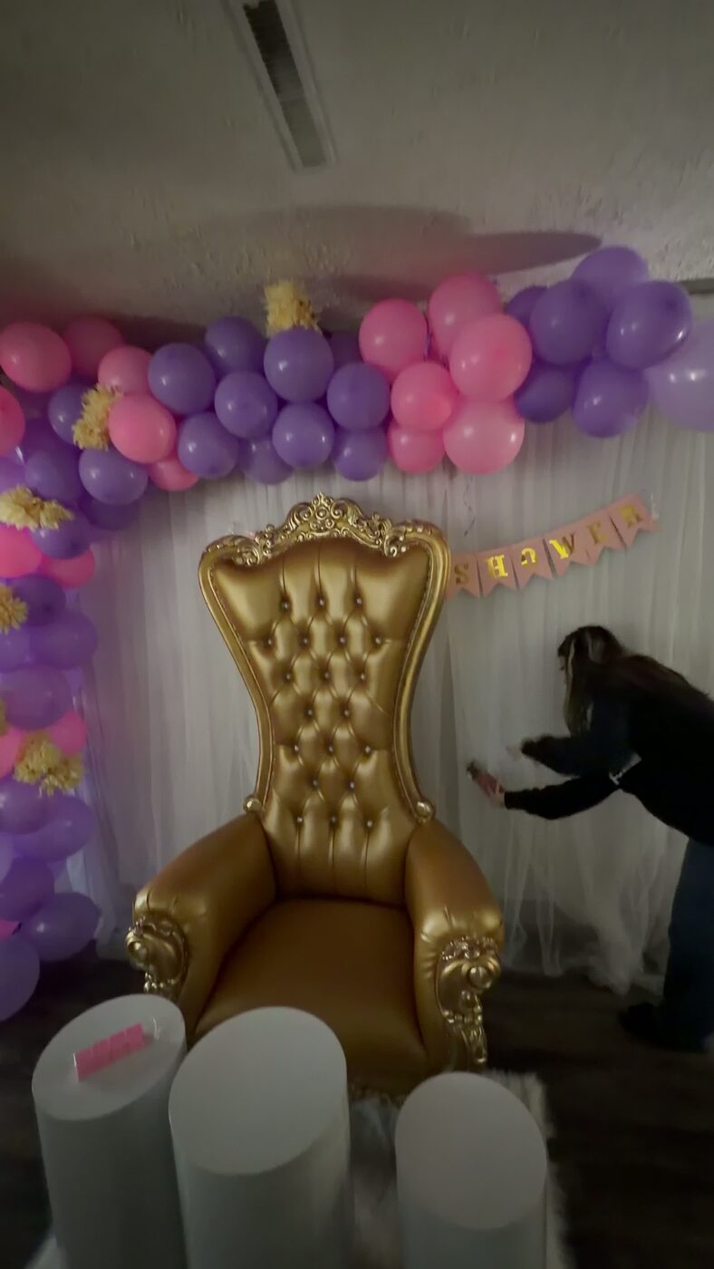 Gold throne chair styled for a baby shower
