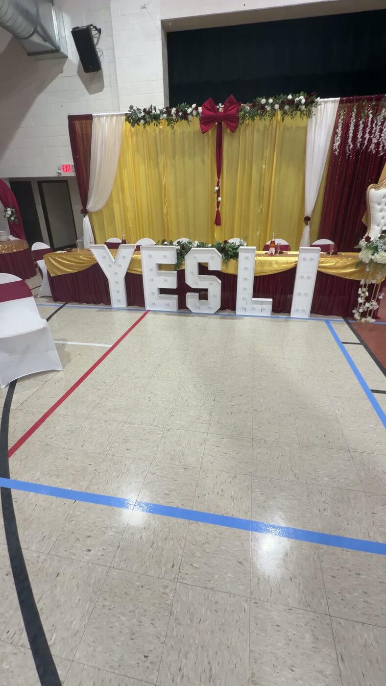 Marquee name letters glowing at a quinceañera